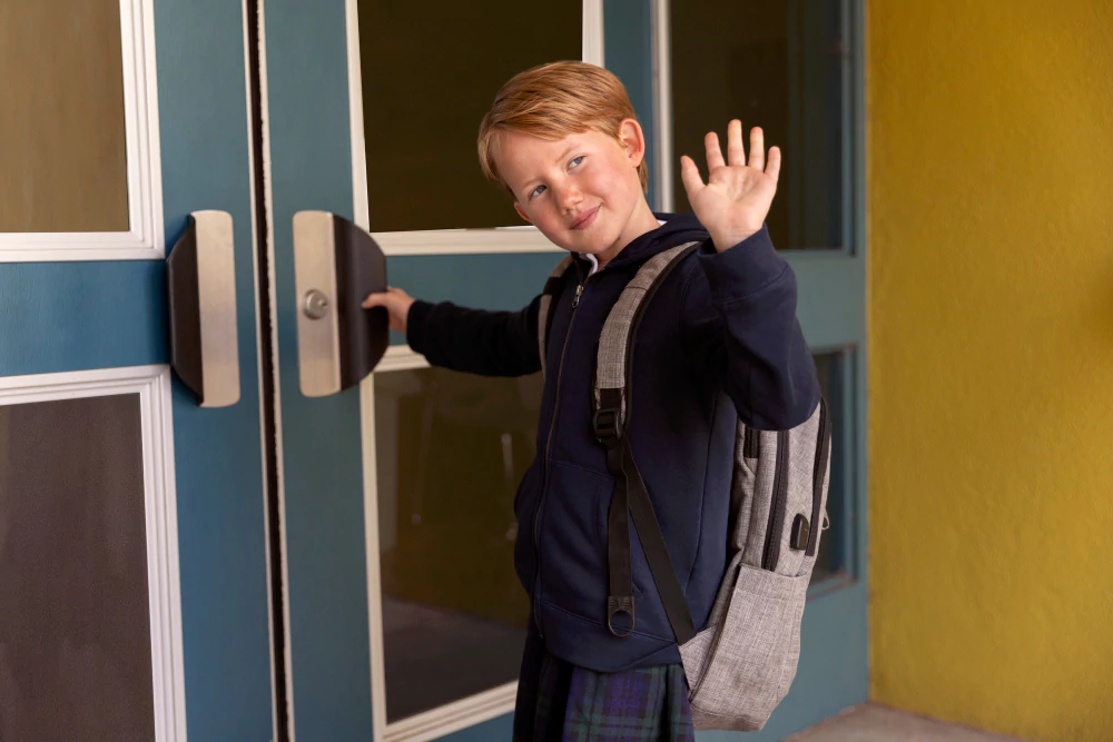 school kid opening gate