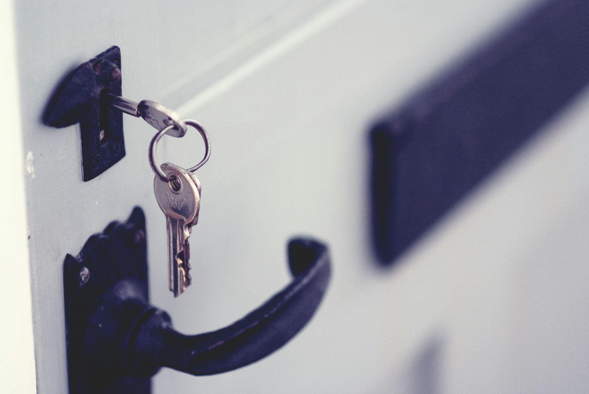 Keys in a white door