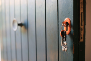 A bunch of keys in a black door