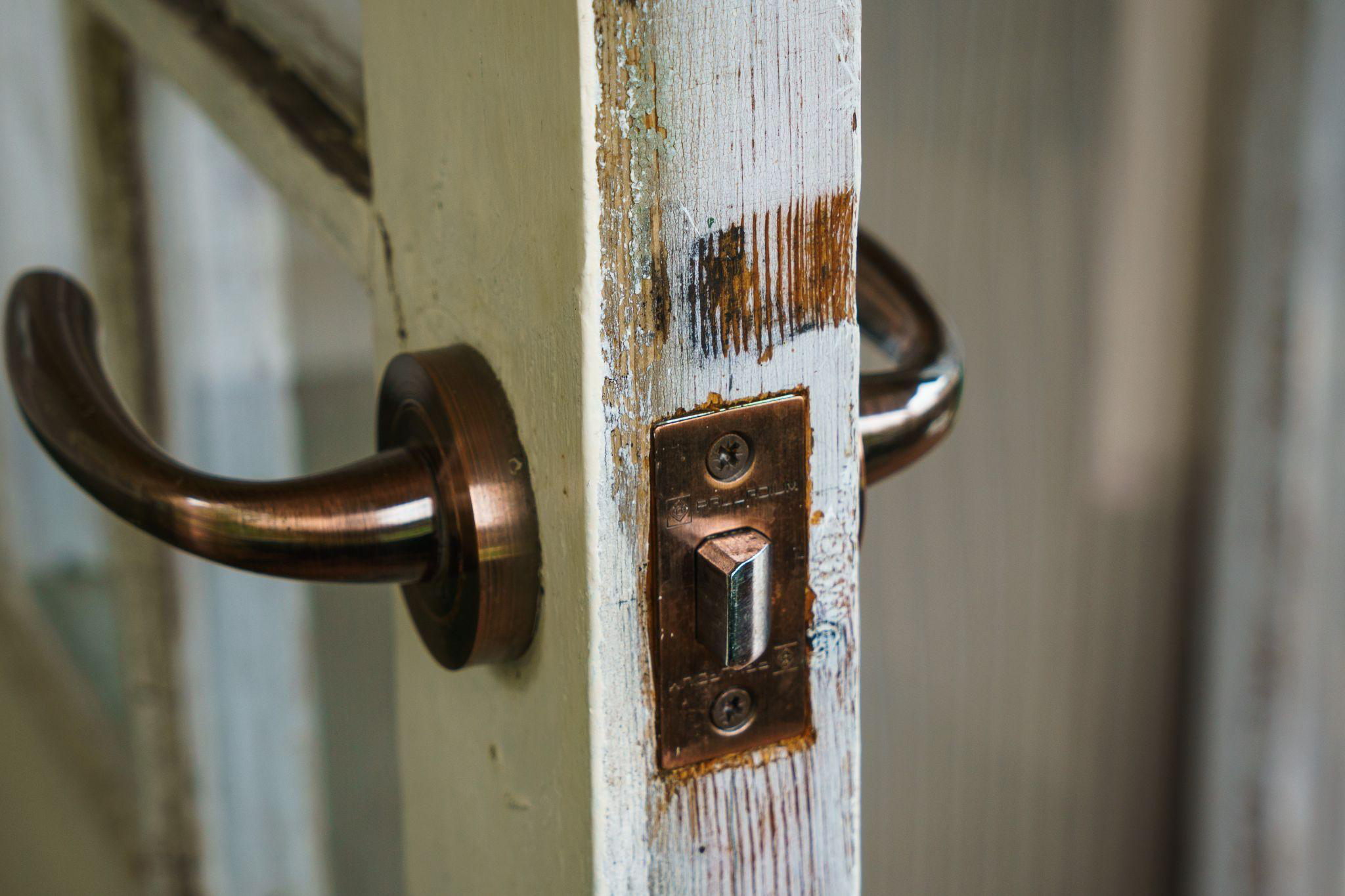 A door lock with significant corrosion